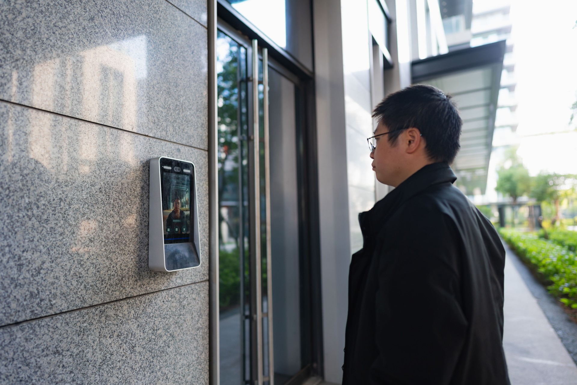 Man uses facial recognition technology to unlock door